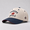 Foxboro Farms hat with a cream crown, navy brim and lettering, and red horse-and-rider detail